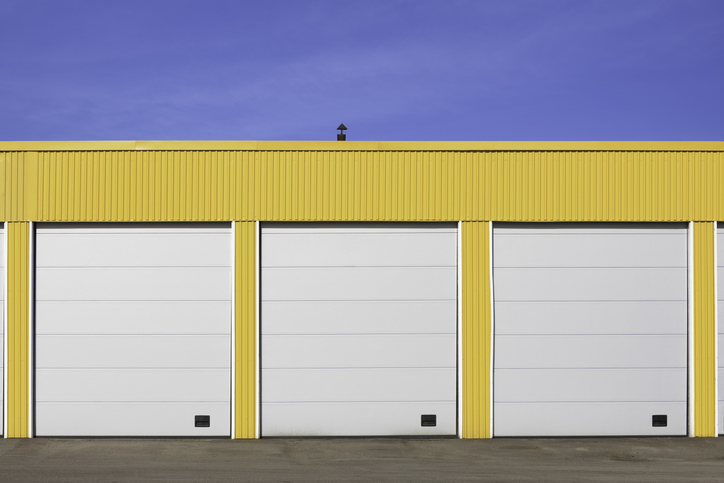 Quick Garage Door Solutions for Broken Springs and Panels